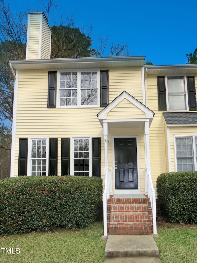 130 Luxon Pl, Cary, NC 27513 - view of front facade with a chimney