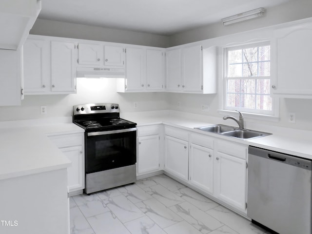 130 Luxon Pl, Cary, NC 27513 - kitchen with a sink, white cabinetry, under cabinet range hood, stainless steel appliances, and marble finish floor