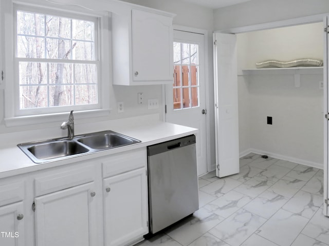 130 Luxon Pl, Cary, NC 27513 - kitchen featuring white cabinets, light countertops, dishwasher, marble finish floor, and a sink