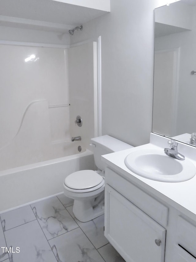 130 Luxon Pl, Cary, NC 27513 - bathroom featuring marble finish floor, toilet, vanity, and washtub / shower combination