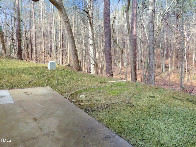 130 Luxon Pl, Cary, NC 27513 - view of yard featuring a view of trees and a patio area