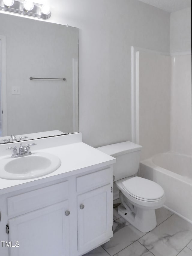 130 Luxon Pl, Cary, NC 27513 - full bath featuring marble finish floor,  shower combination, toilet, and vanity