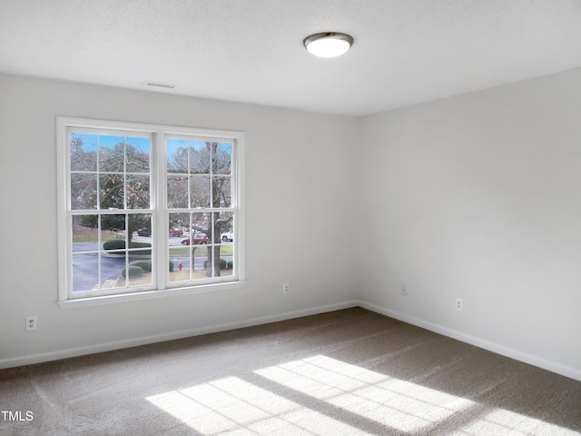 130 Luxon Pl, Cary, NC 27513 - carpeted spare room featuring baseboards and visible vents