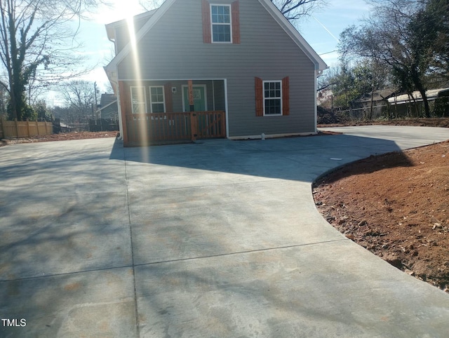 view of property exterior featuring covered porch