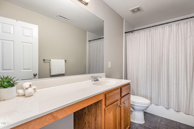 full bathroom with tile patterned flooring, vanity, shower / tub combo, and toilet