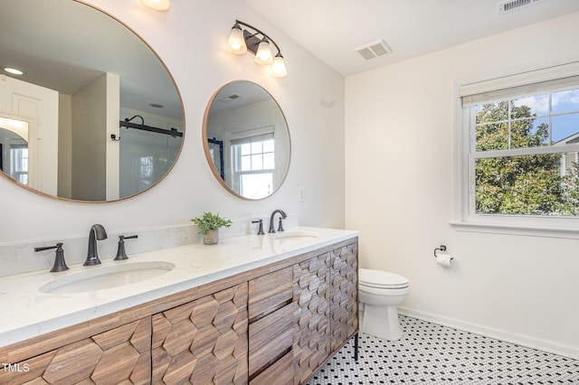 bathroom with vanity and toilet