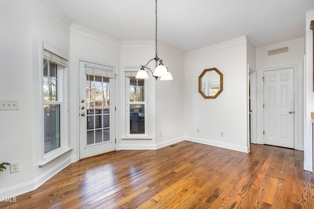 unfurnished dining area featuring crown molding and dark wood-type flooring