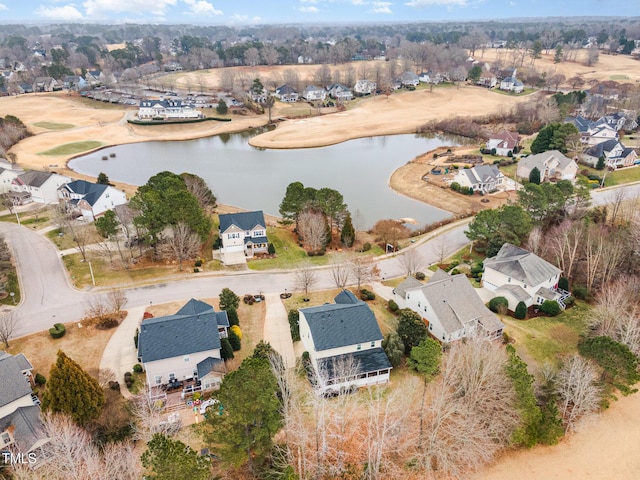 drone / aerial view with a residential view and a water view