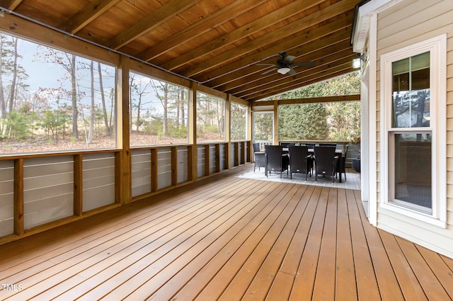 unfurnished sunroom with a ceiling fan, lofted ceiling, and wood ceiling