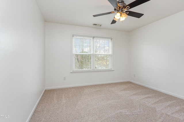 unfurnished room featuring a ceiling fan, baseboards, visible vents, and carpet flooring