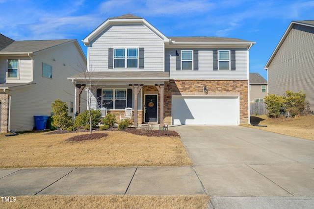 craftsman-style home featuring a garage, central AC unit, concrete driveway, stone siding, and covered porch