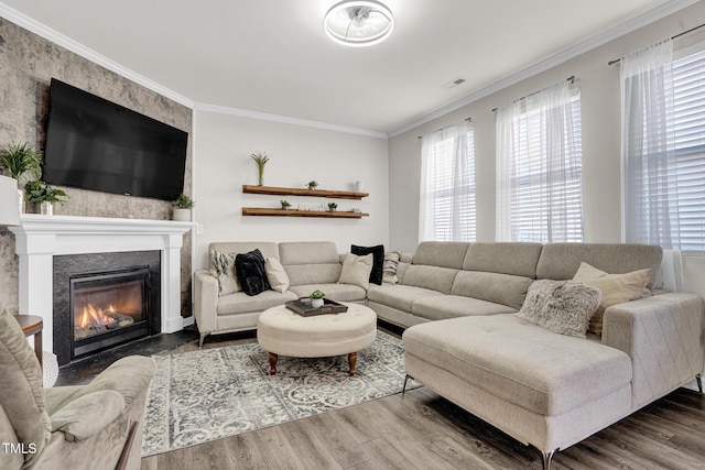 living room featuring hardwood / wood-style floors and ornamental molding