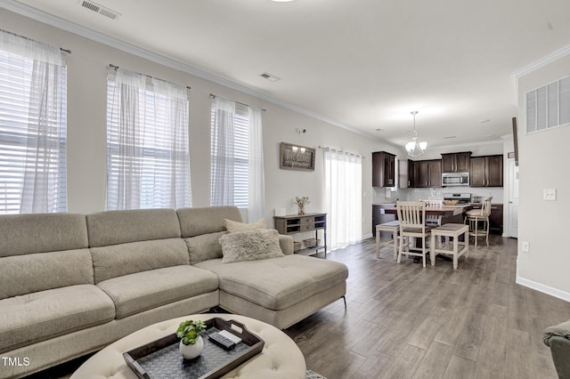 living room with ornamental molding and wood-type flooring