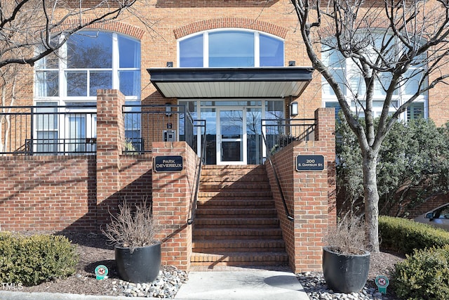 view of front of house featuring brick siding