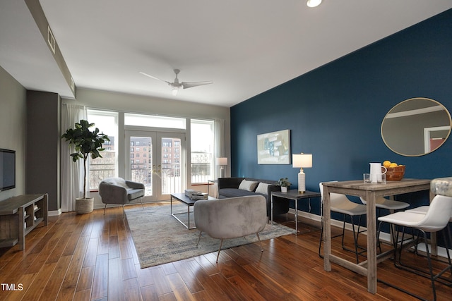 living room with dark wood-style floors, french doors, a ceiling fan, and baseboards