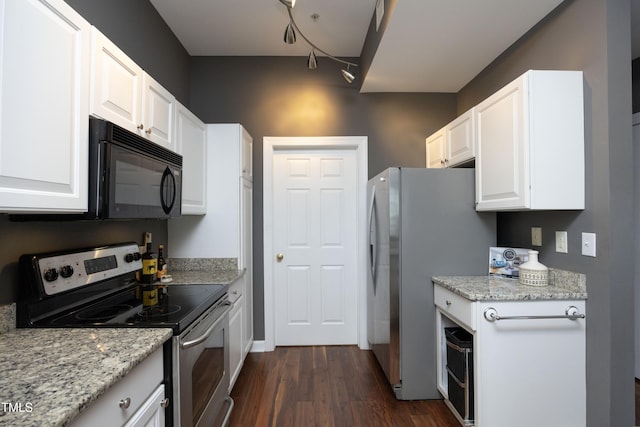 kitchen with light stone counters, appliances with stainless steel finishes, dark wood-style flooring, and white cabinetry