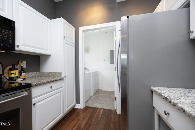 kitchen featuring light stone counters, stainless steel appliances, separate washer and dryer, dark wood-type flooring, and white cabinets