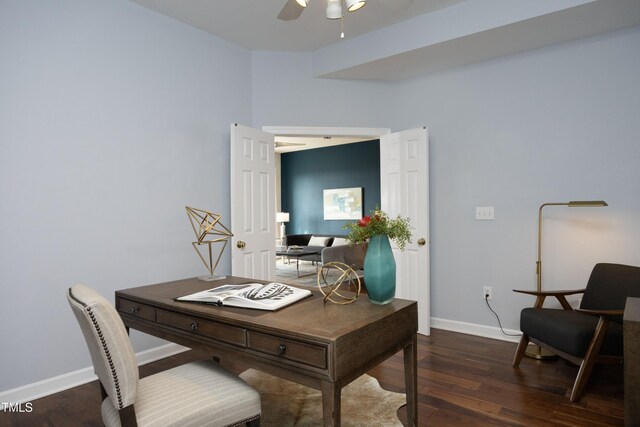 office with ceiling fan, baseboards, and dark wood-type flooring