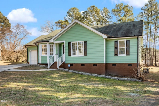 view of front of house with a garage and a front yard