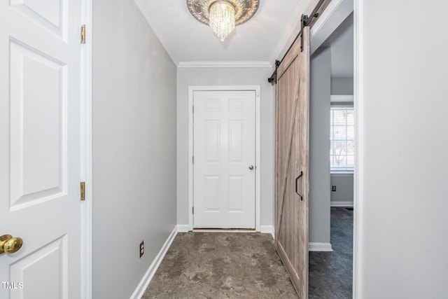 doorway with crown molding and a barn door