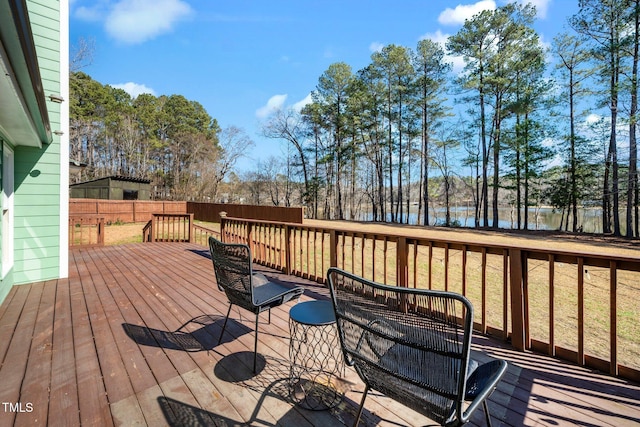 wooden deck with a water view