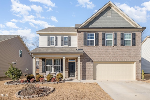 view of front of home featuring a garage and covered porch