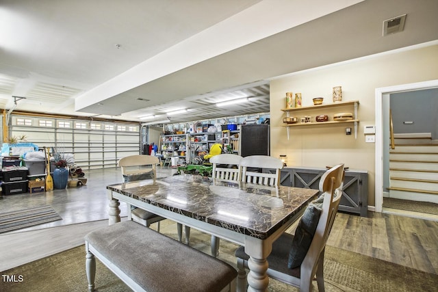 dining area featuring dark hardwood / wood-style flooring