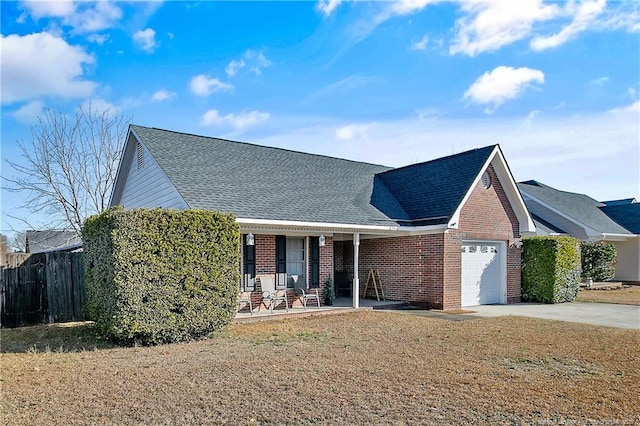 view of front facade with a garage, a front yard, and covered porch