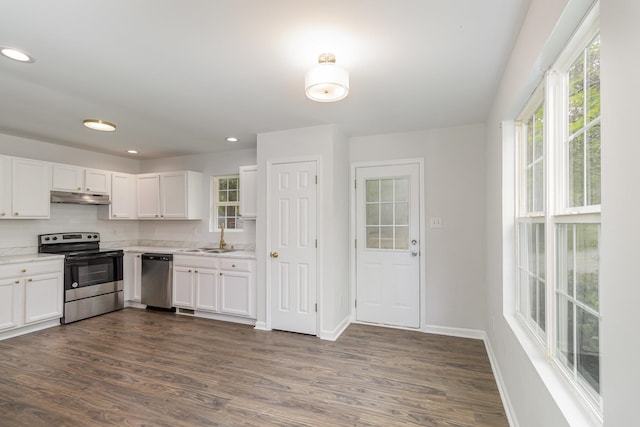 kitchen featuring sink, white cabinets, and appliances with stainless steel finishes