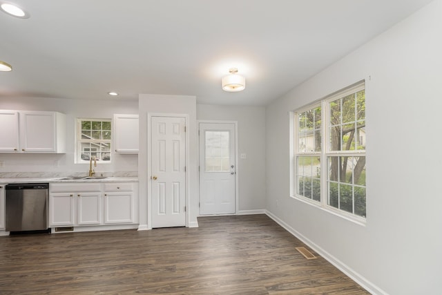 kitchen featuring white cabinetry, stainless steel dishwasher, dark hardwood / wood-style floors, and sink