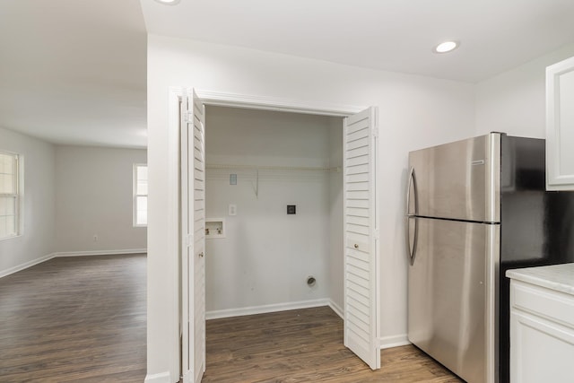 laundry room featuring hookup for a washing machine and dark hardwood / wood-style flooring