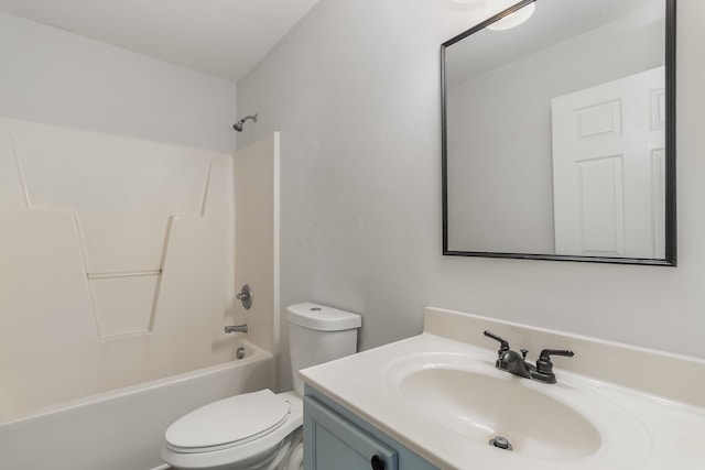 full bathroom featuring washtub / shower combination, vanity, and toilet