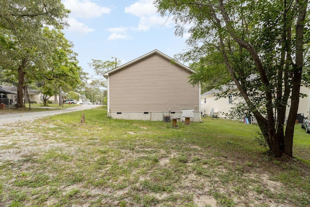 view of home's exterior with a lawn