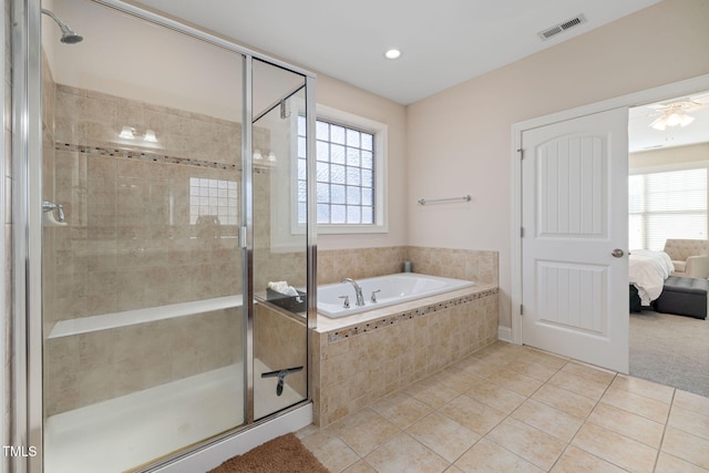 ensuite bathroom with a stall shower, tile patterned flooring, and visible vents