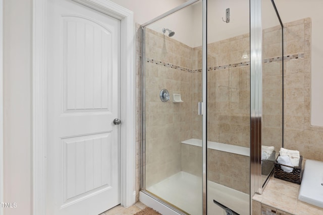 full bath featuring a shower stall