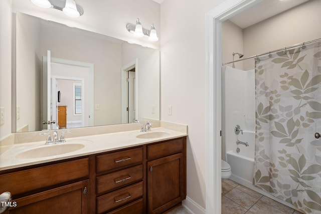 full bath featuring shower / tub combo, double vanity, a sink, and tile patterned floors