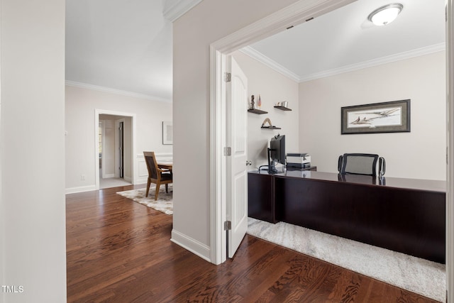 office featuring ornamental molding, baseboards, and wood finished floors