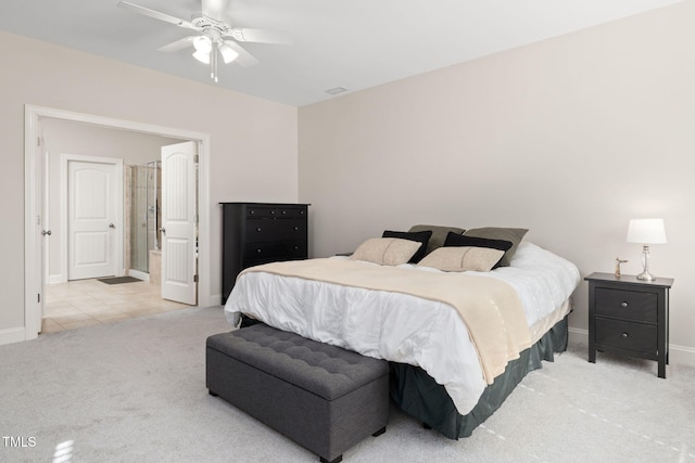 bedroom featuring carpet flooring, ceiling fan, baseboards, and ensuite bathroom