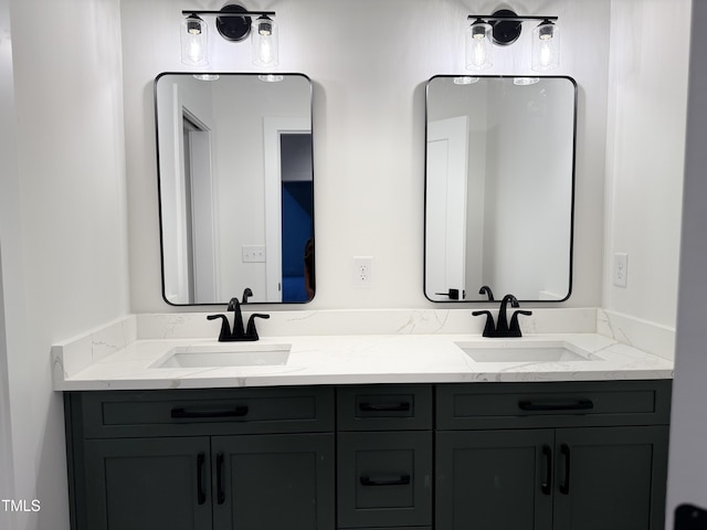 bathroom featuring double vanity and a sink