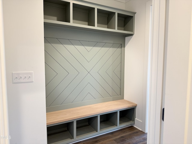 mudroom with dark wood finished floors