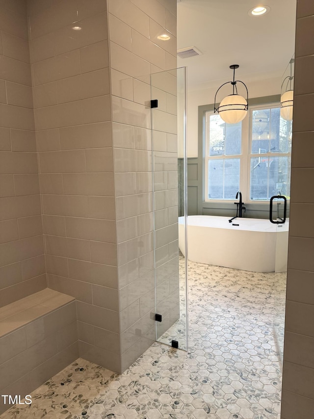 bathroom featuring a stall shower, visible vents, a soaking tub, tile patterned floors, and recessed lighting