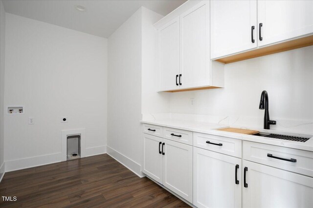 321 Bud Wall Rd, Youngsville, NC 27596 - laundry room featuring a sink, cabinet space, hookup for an electric dryer, hookup for a washing machine, and dark wood-style flooring