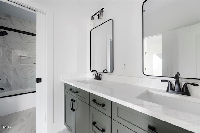 321 Bud Wall Rd, Youngsville, NC 27596 - full bath featuring a sink, marble finish floor, combined bath / shower with glass door, and double vanity