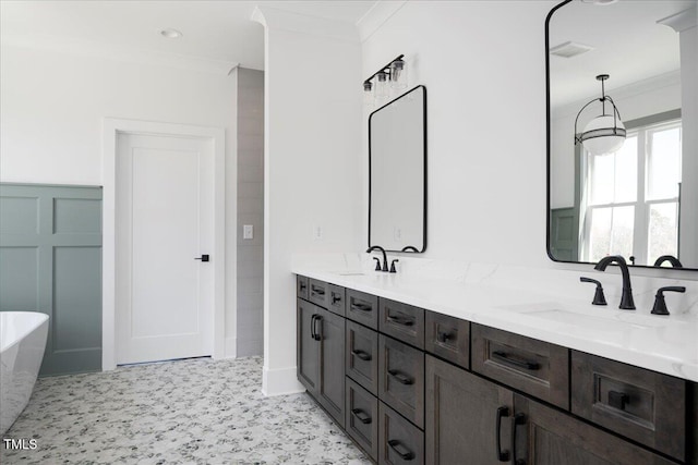 321 Bud Wall Rd, Youngsville, NC 27596 - full bathroom featuring a sink, a soaking tub, double vanity, and crown molding