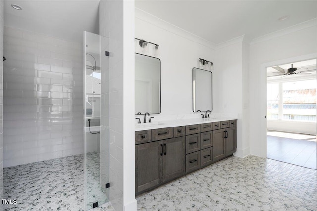 321 Bud Wall Rd, Youngsville, NC 27596 - bathroom with ornamental molding, a ceiling fan, a sink, double vanity, and tiled shower