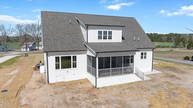 321 Bud Wall Rd, Youngsville, NC 27596 - rear view of house featuring roof with shingles and a sunroom