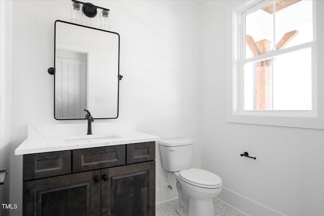 321 Bud Wall Rd, Youngsville, NC 27596 - half bathroom featuring speckled floor, baseboards, toilet, and vanity