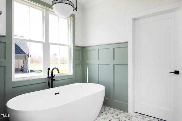 321 Bud Wall Rd, Youngsville, NC 27596 - full bath with a soaking tub, a decorative wall, a wainscoted wall, and a sink
