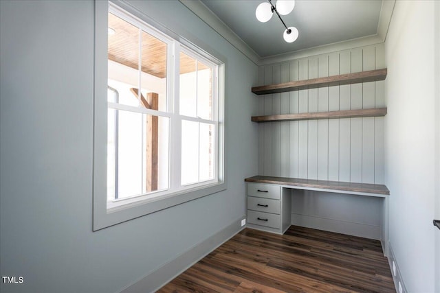 321 Bud Wall Rd, Youngsville, NC 27596 - unfurnished office with baseboards, built in desk, and dark wood-style flooring
