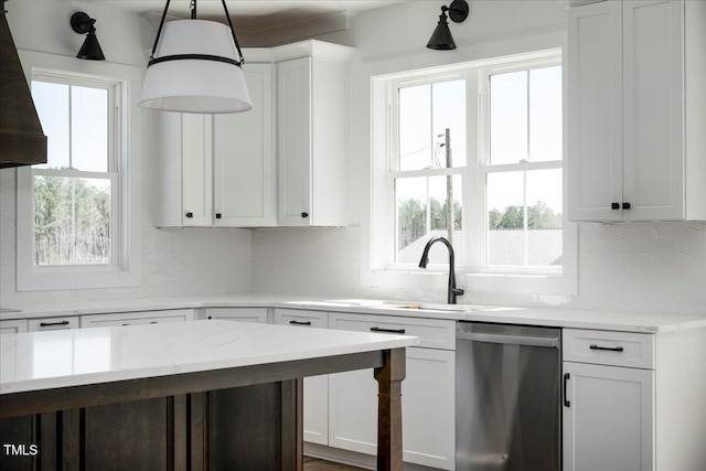 321 Bud Wall Rd, Youngsville, NC 27596 - kitchen with a wealth of natural light, white cabinetry, dishwasher, and wall chimney range hood